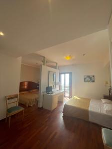 Postel nebo postele na pokoji v ubytování Hotel La Lampara
