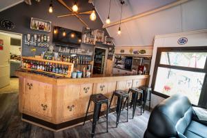 a bar in a restaurant with bar stools at ULVF Ty an Diaoul in Sarzeau