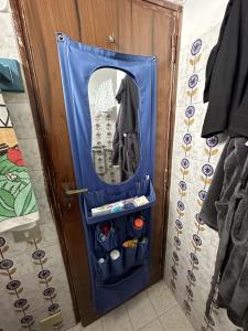 a door with a mirror in a room at Appartamento monolocale Fiuggi 14 MQ piscina dal 20 giugno al 15 settembre in Fiuggi
