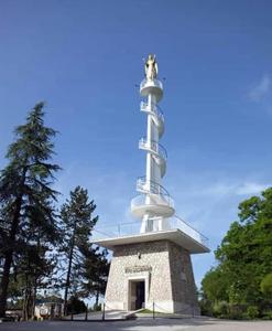 a lighthouse with a statue on top of it at Appartamento monolocale Fiuggi 14 MQ piscina dal 20 giugno al 15 settembre in Fiuggi