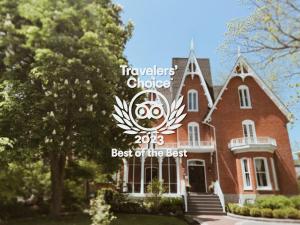 a house with a sign that says travelers choice best of the best at Merrill House in Picton