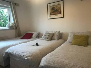 a bedroom with two beds and a couch at Dublin Home by Clonsilla train 25min to City in Dublin