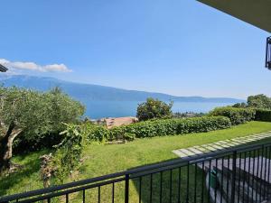 a balcony with a view of the water at CRISTOL 12 in Gargnano