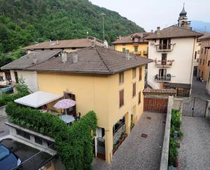 an overhead view of a building with an umbrella at Casa Anna in Ledro