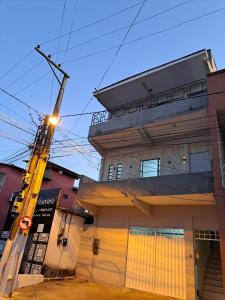 a building with a yellow crane in front of it at João eudes Rodrigues de Souza in Marabá
