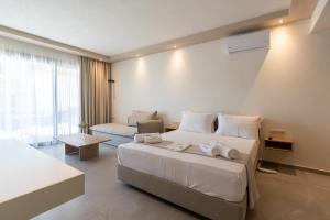 Postel nebo postele na pokoji v ubytování La Boheme Suites