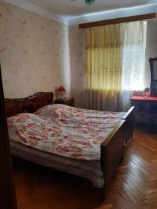 Postel nebo postele na pokoji v ubytování hotel in chiatura