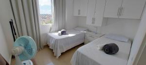 Ein Bett oder Betten in einem Zimmer der Unterkunft COPIA0102 - Condomínio Cores de Piatã
