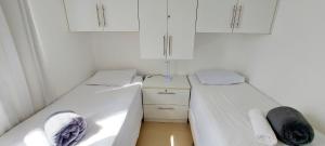 Ein Bett oder Betten in einem Zimmer der Unterkunft COPIA0102 - Condomínio Cores de Piatã