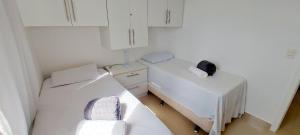 Ein Bett oder Betten in einem Zimmer der Unterkunft COPIA0102 - Condomínio Cores de Piatã