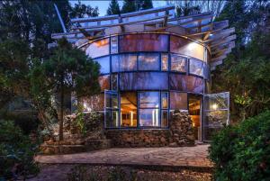 a large home with a large building on a hill at The Lantern @ Fantasia in Hogsback