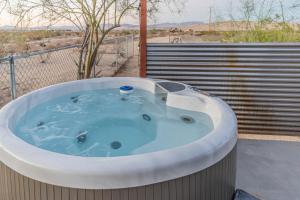 a jacuzzi tub on a balcony with a view at NEW PROPERTY! The Cactus Villas at Joshua Tree National Park - Pool, Hot Tub, Outdoor Shower, Fire Pit in Twentynine Palms