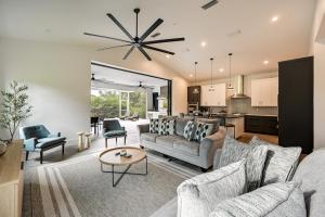 a living room with a couch and a table at Contemporary Naples Home with Outdoor Kitchen and Pool in Naples