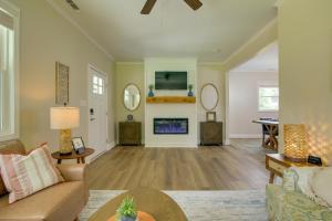 a living room with a couch and a fireplace at Dog-Friendly Jackson Home Near Downtown Hub! in Jackson