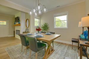 a dining room and living room with a table and chairs at Dog-Friendly Jackson Home Near Downtown Hub! in Jackson