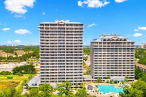 two tall buildings with a pool in between them at Spectacular view Blue Heron Beach Resort Near Disney in Orlando