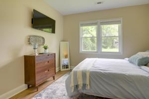 a bedroom with a bed and a dresser and a window at Dog-Friendly Jackson Home Near Downtown Hub! in Jackson