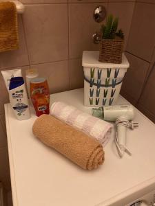 a bathroom counter with a towel and a sink at Apartment Niko in Split