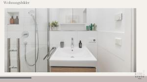 a white bathroom with a sink and a shower at Design-Apartment - Gusto stays! in Remseck am Neckar