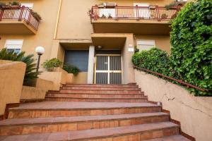 a set of stairs leading to a building with a door at Malù - Bed & Breakfast in Agrigento