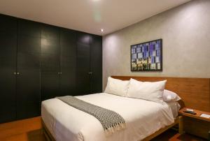 Cama o camas de una habitación en Industrial 2BR near Malecon in Miraflores