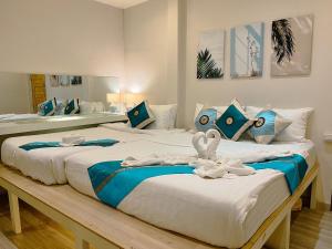 Postel nebo postele na pokoji v ubytování Pure Stay At CNX