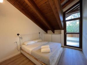 Postel nebo postele na pokoji v ubytování BPIRINEOS- Aire Pirineos + 9 fotografií