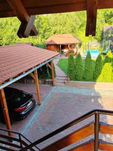 a car parked in the driveway of a house at LaSovataa in Sovata