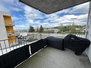 a black tent on a balcony with a parking lot at Apartment Lyngas - Birta Rentals in Garðabær