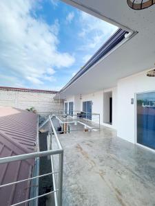 a view from the balcony of a house with a roof at Sunset Paradise Moalboal in Moalboal