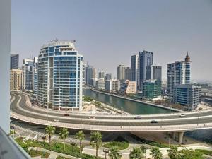 a city with a highway and a bridge and buildings at Key View - Address JBR in Dubai
