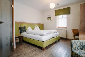 Voodi või voodid majutusasutuse Gästehaus Thomahan toas