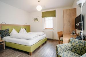 Postel nebo postele na pokoji v ubytování Gästehaus Thomahan