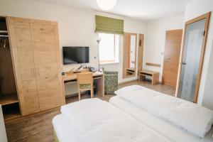 Voodi või voodid majutusasutuse Gästehaus Thomahan toas