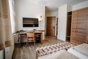Voodi või voodid majutusasutuse Gästehaus Thomahan toas