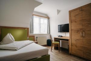Voodi või voodid majutusasutuse Gästehaus Thomahan toas
