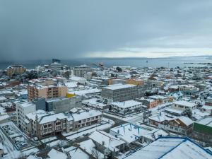 an aerial view of a city covered in snow at Almasur Express Punta Arenas in Punta Arenas