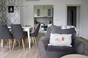 a living room with a chair and a table at Vista di Cattaro in Kotor
