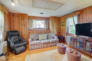 a living room with a couch and a flat screen tv at Silver Spring Rental 8 Mi to Washington, DC! in Silver Spring