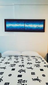 Postel nebo postele na pokoji v ubytování Hotel Beijing Cartagena