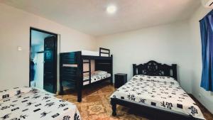 Postel nebo postele na pokoji v ubytování Hotel Beijing Cartagena