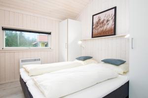 Postel nebo postele na pokoji v ubytování Resort 1 Ferienhaus Typ D 160