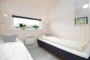 Postel nebo postele na pokoji v ubytování Resort 1 Ferienhaus Typ D 160