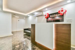 a waiting room at a hotel with a reception desk at Collection O 80868 Hotel Addiction in Patna