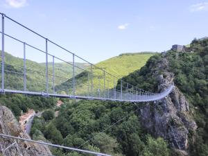 a suspension bridge on a mountain with a river at Villa METICA - Aussillon/Mazamet in Aussillon