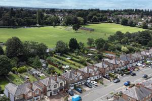 an aerial view of a town with houses and a field at Stunning Home Ideal for Business - Free Parking in Birstall