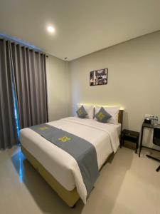 Postel nebo postele na pokoji v ubytování Ghurfati Hotel Wedana