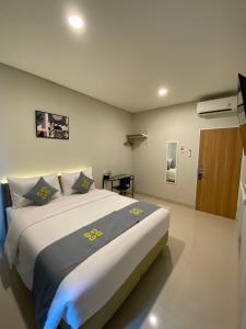 Postel nebo postele na pokoji v ubytování Ghurfati Hotel Wedana