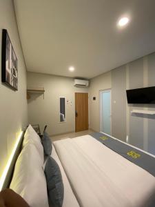 Postel nebo postele na pokoji v ubytování Ghurfati Hotel Wedana
