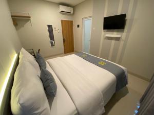 Postel nebo postele na pokoji v ubytování Ghurfati Hotel Wedana
